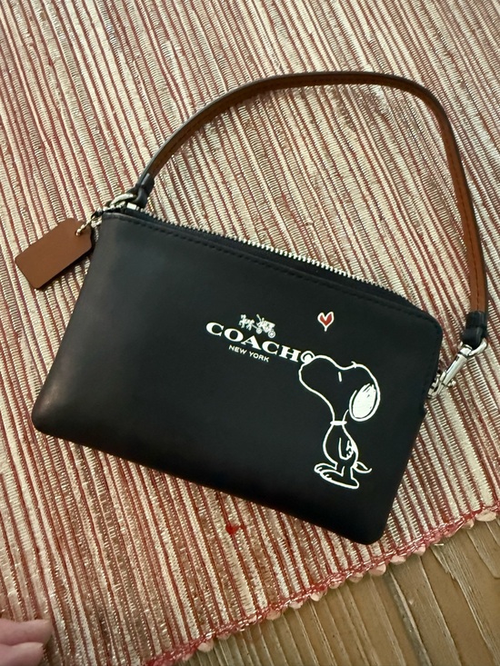 Coach Handbags - COACH Black Snoopy Kiss Wristlet with Strap, new without tags